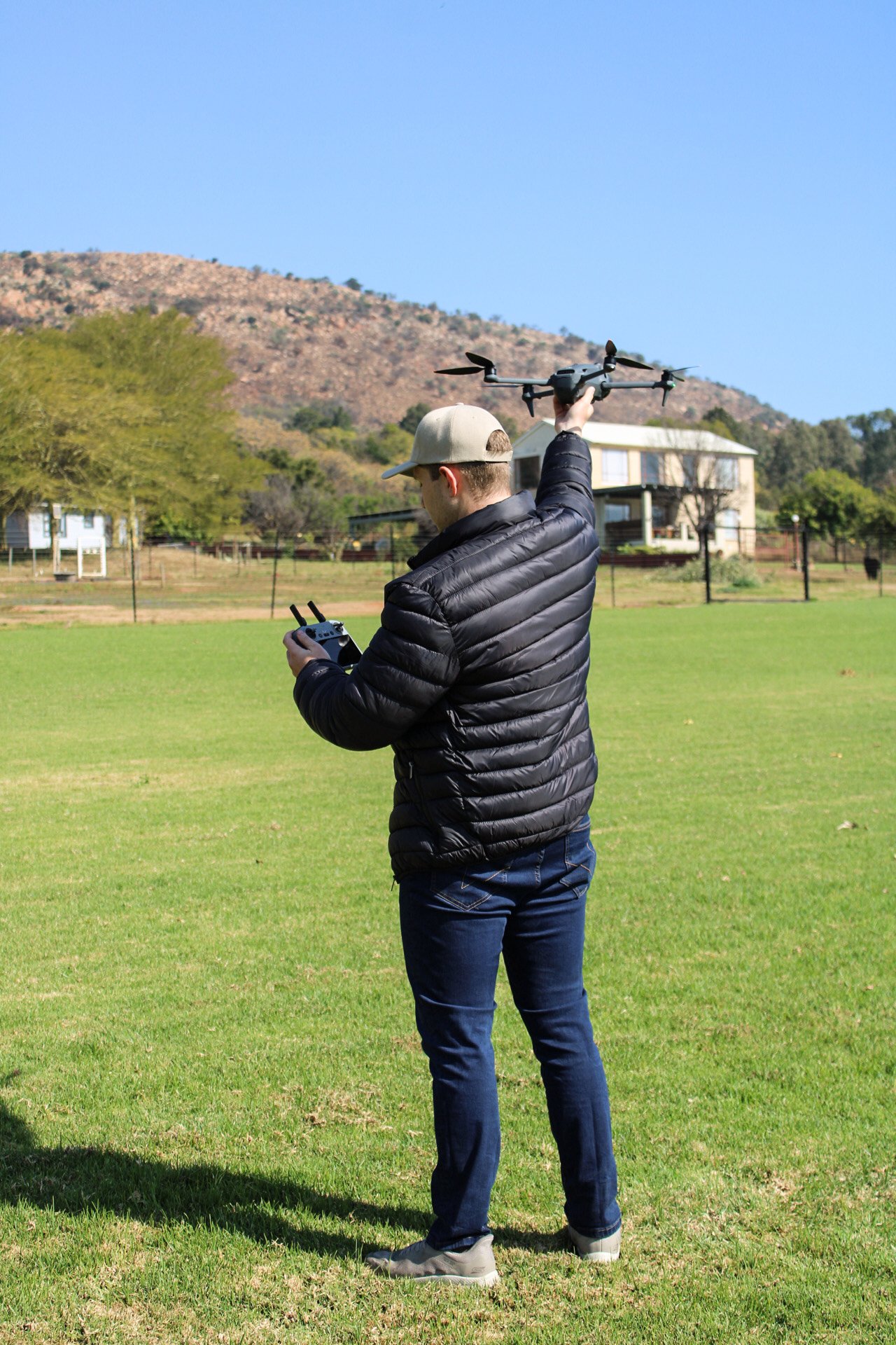 TEN8 remote pilot launching a drone for a BVLOS mission on open ground