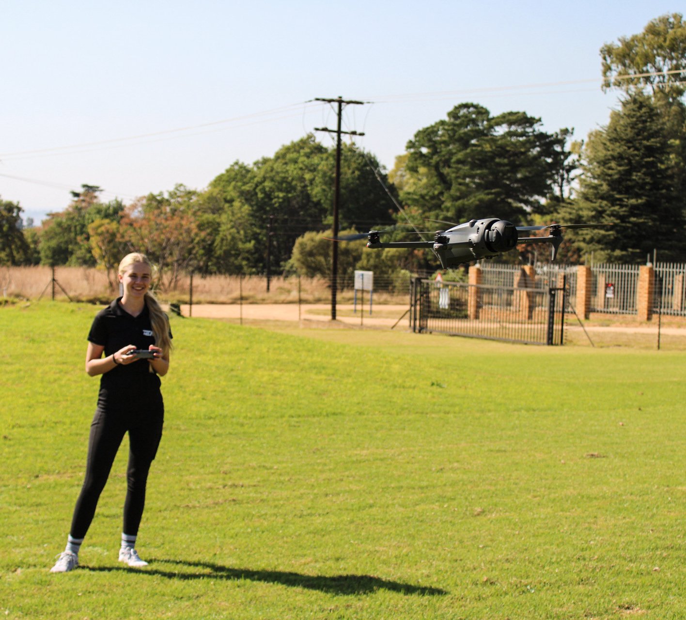 TEN8 remote pilot candidate flying a training pattern with drone airborne